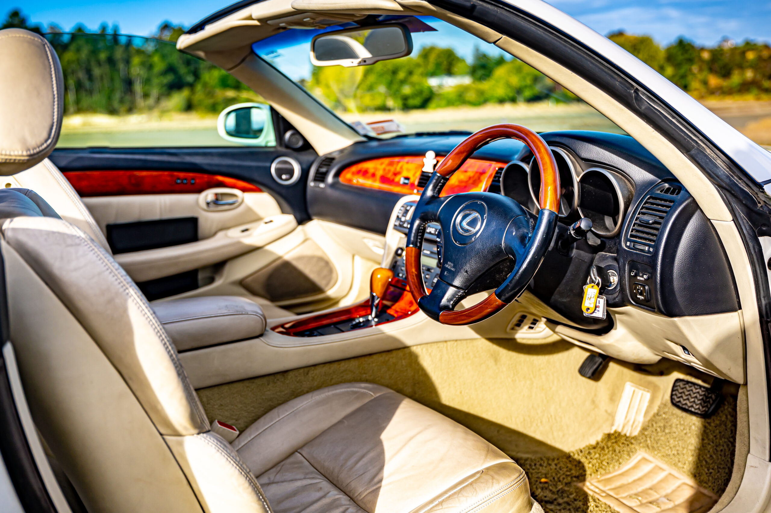 RentAClassics Lexus SC430 wood and cream leather interior with roof down